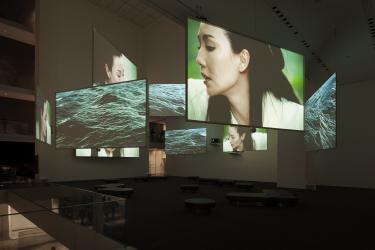 Image: Isaac Julien, Ten Thousand Waves (2010), nine-screen installation view, Museum of Modern Art, New York, 2013-14 